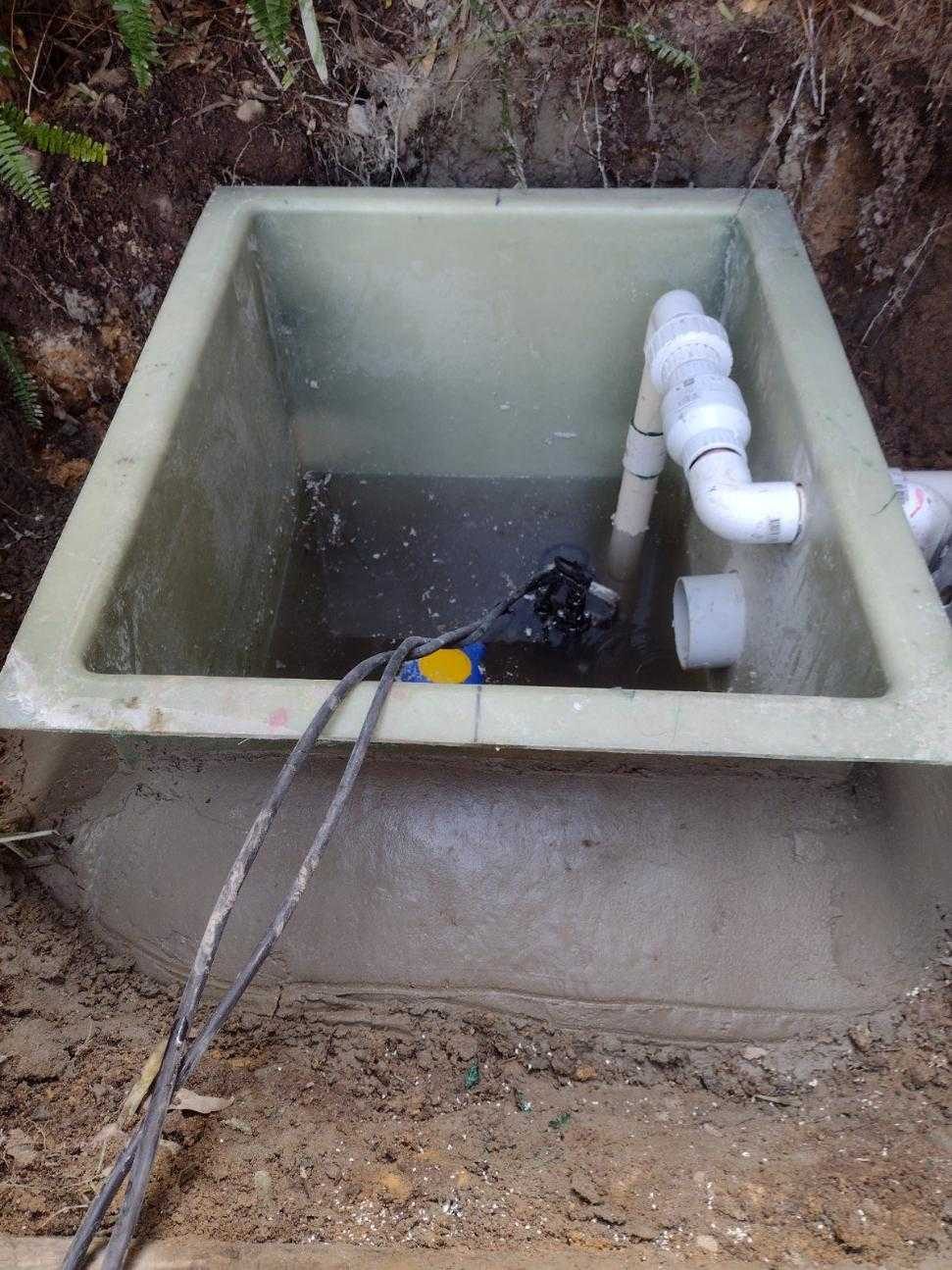 New fibreglass pump pit installed on a fresh concrete bed with pipework on a Sydney home build