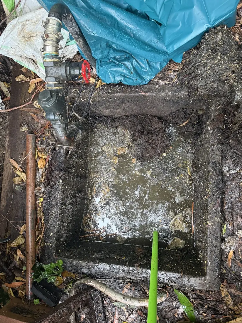 An old sewer pump pit on an older Sydney property before the ageing pump system is replaced