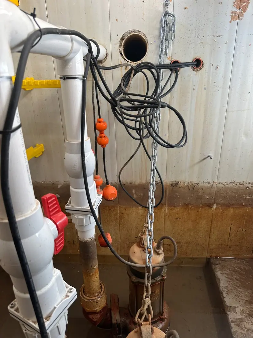 A Saber pump in a new Ryde home's pit with loose tangled cabling left where it can obstruct the float